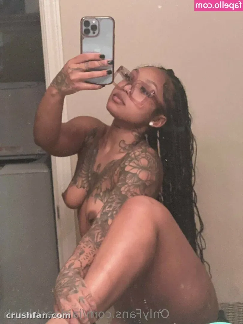 TasteofJaida taking a mirror selfie indoors with tattoos visible