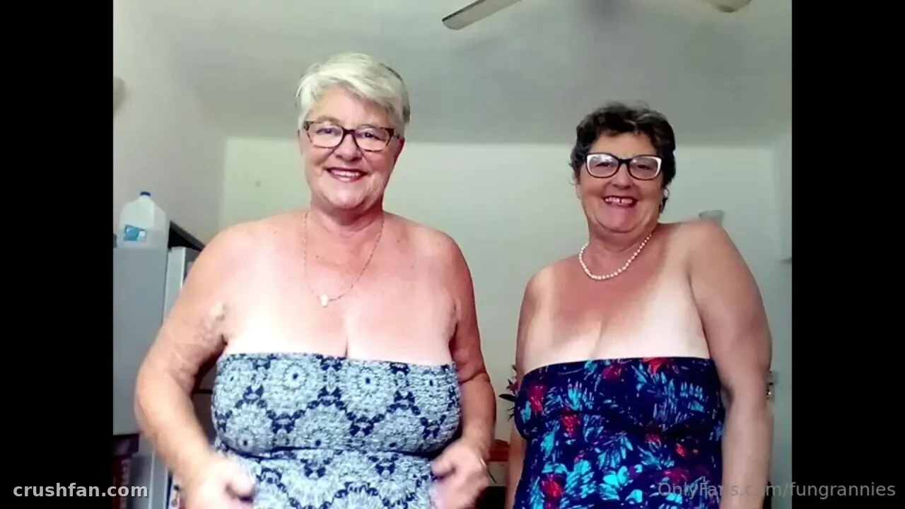 Fungrannies smiling indoors in a blue and white floral strapless top