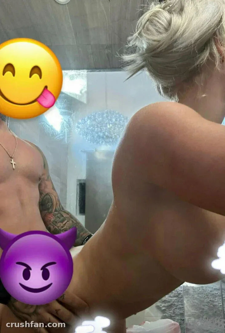 Laci Kay Somers VIP in a bright bathroom mirror selfie with a chandelier overhead