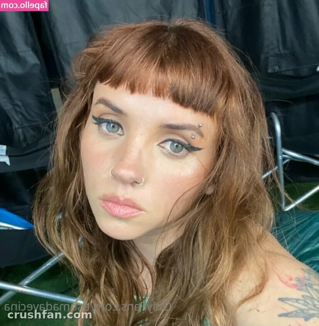 Close-up selfie of Estimada Vecina with auburn fringe and winged eyeliner
