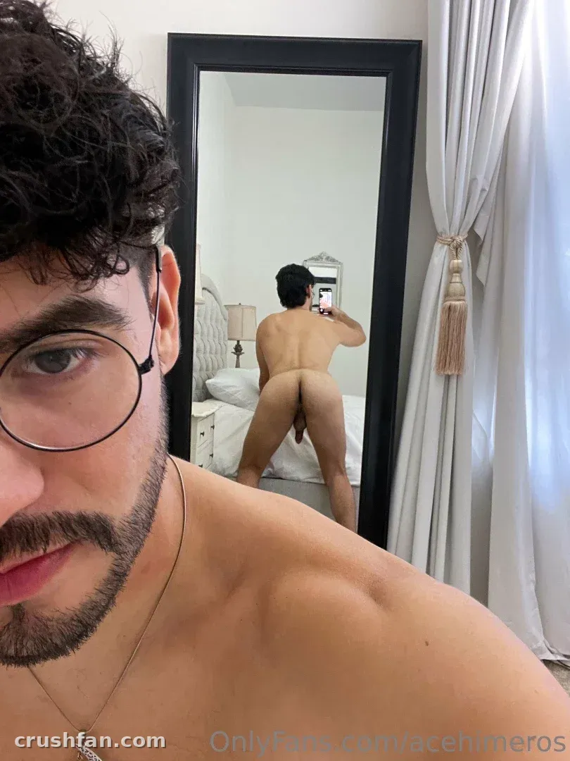 Ace Himeros ASMR taking a mirror selfie in a bright bedroom with sheer curtains.