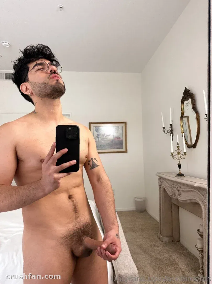Ace Himeros ASMR taking a mirror selfie in a bedroom with vintage decor.