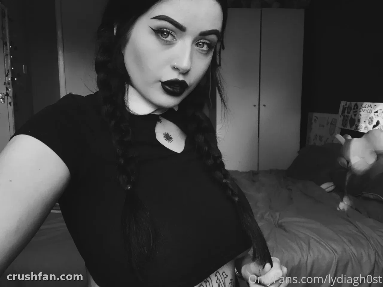 Black and white bedroom selfie of Lydia Gh0st with braided hair and dark lipstick