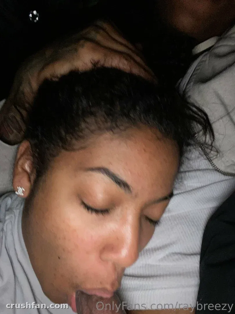Close-up low-light portrait of Ray Breezy with eyes closed