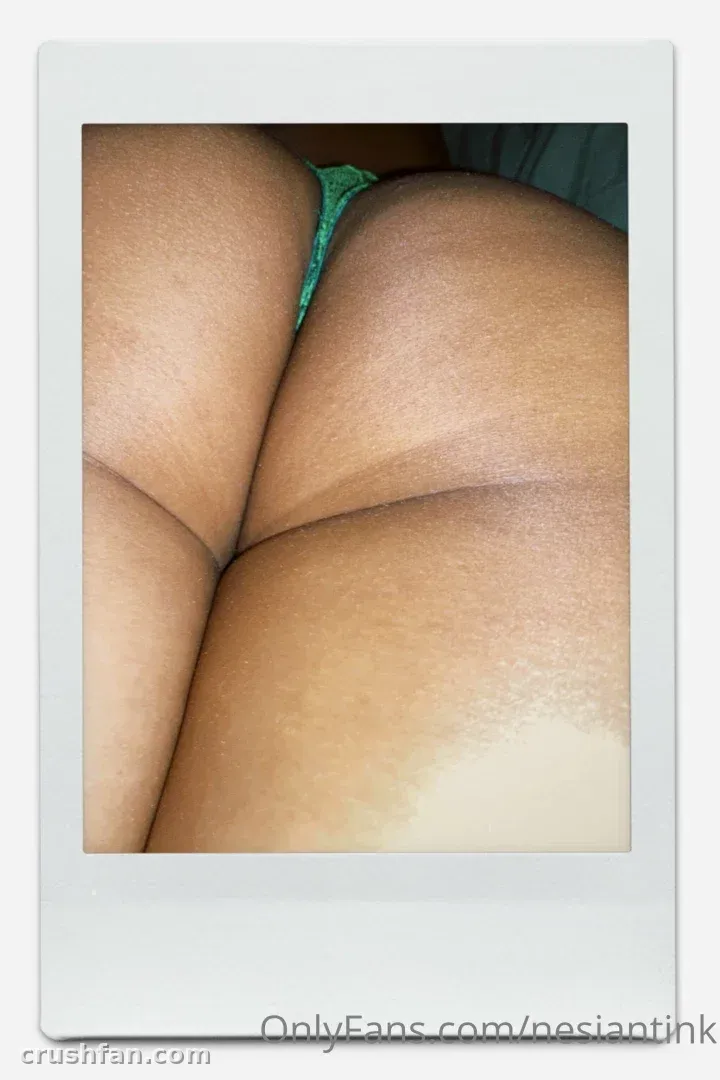 Close-up of warm skin tones with a green bikini detail inside a white instant-photo frame