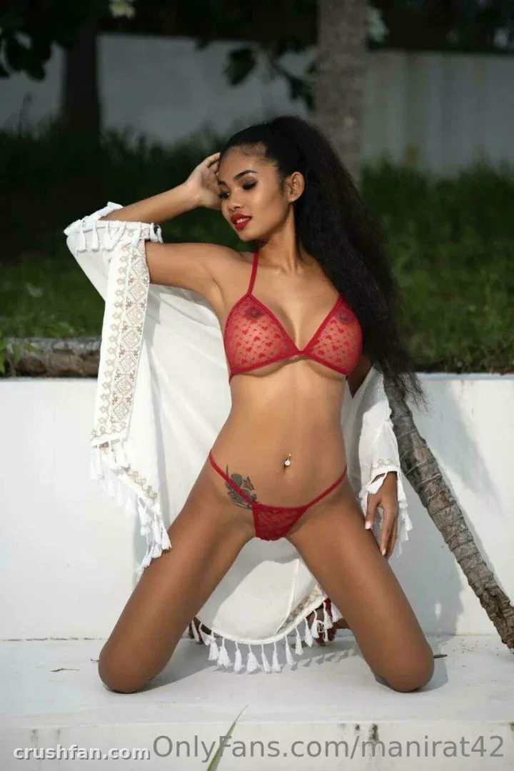 Daisyd kneeling outdoors in red lingerie with a white fringed cover-up